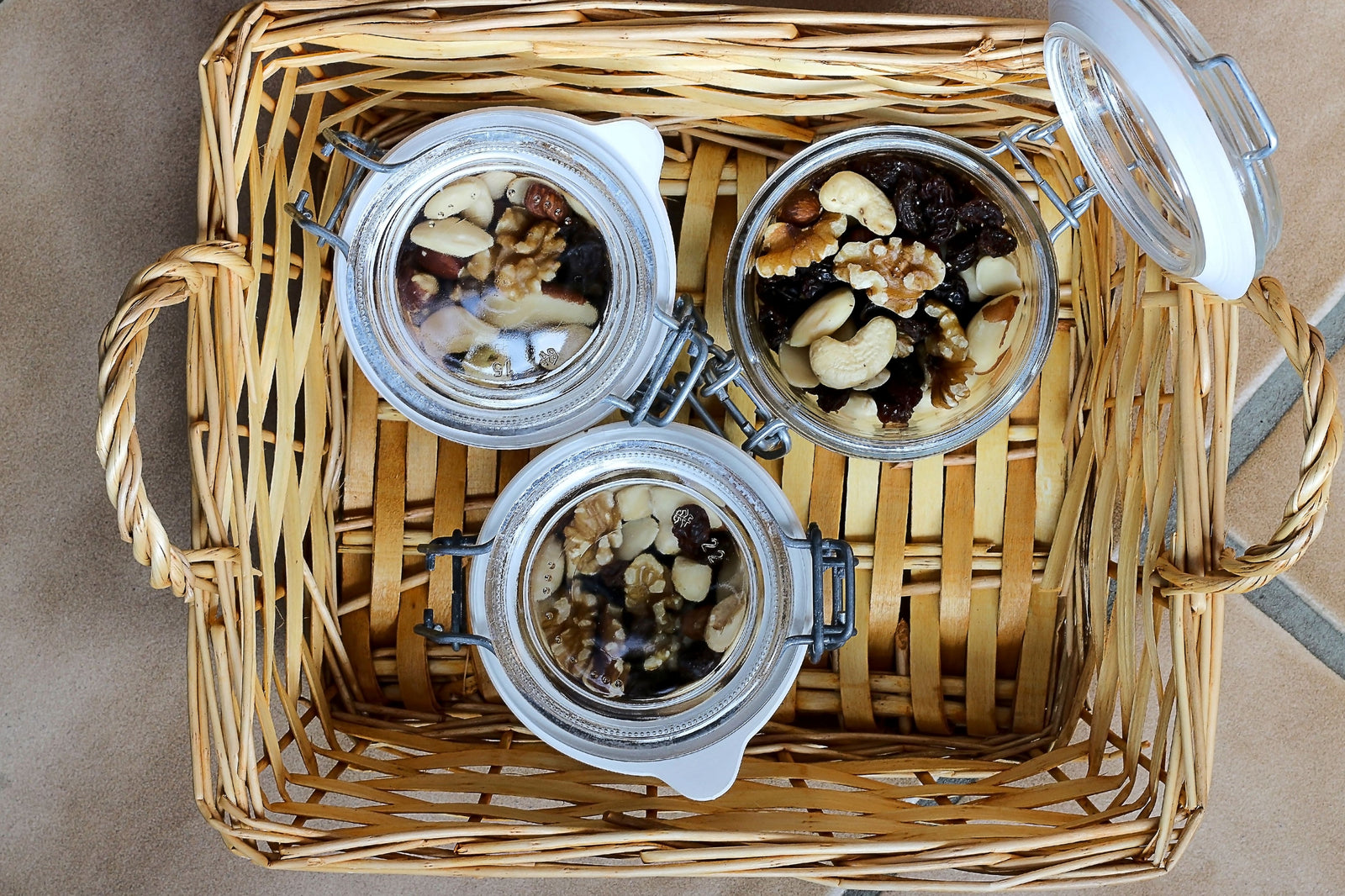 3 jars of assorted nuts + seeds in a wicker basket - Sheila Pedraza | Adashiko Collagen | 100% Natural Skincare