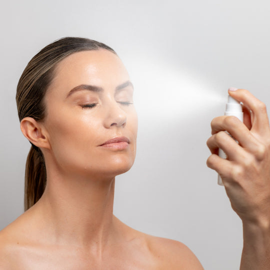 Collagen Hydra+ Multi Mist - model holding bottle and spraying mist onto her face | Adashiko Collagen | 100% Natural Skincare