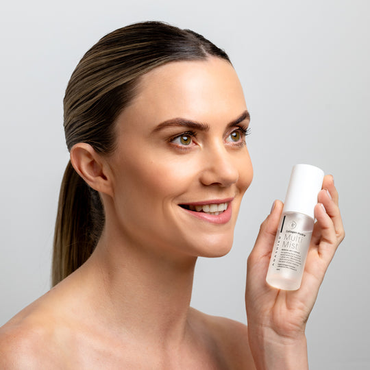 Collagen Hydra+ Multi Mist - model holding a bottle next to her face | Adashiko Collagen | 100% Natural Skincare
