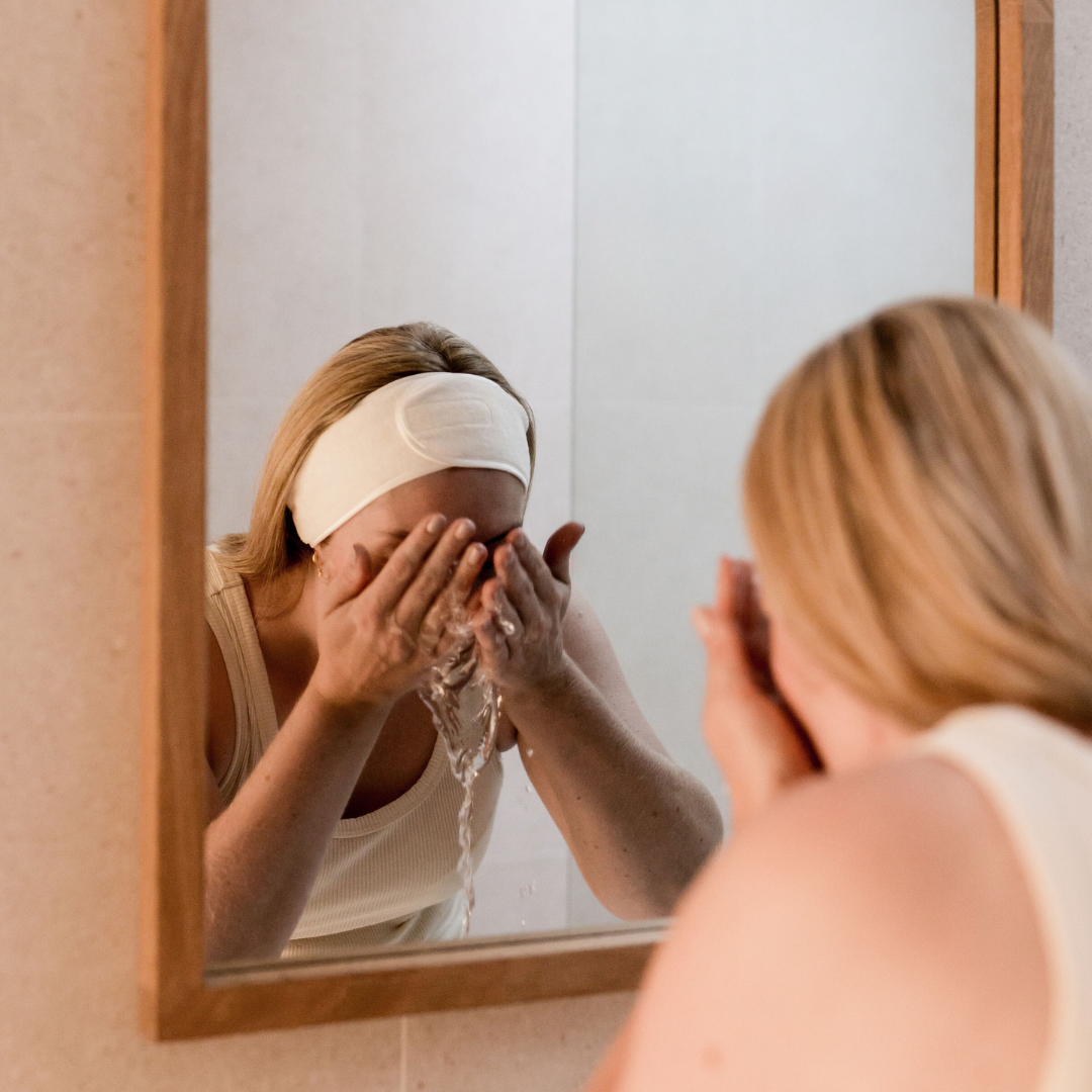 Microfibre Spa Headband wrapped around a model's head as she cleanses her face | Adashiko Collagen | 100% Natural Skincare