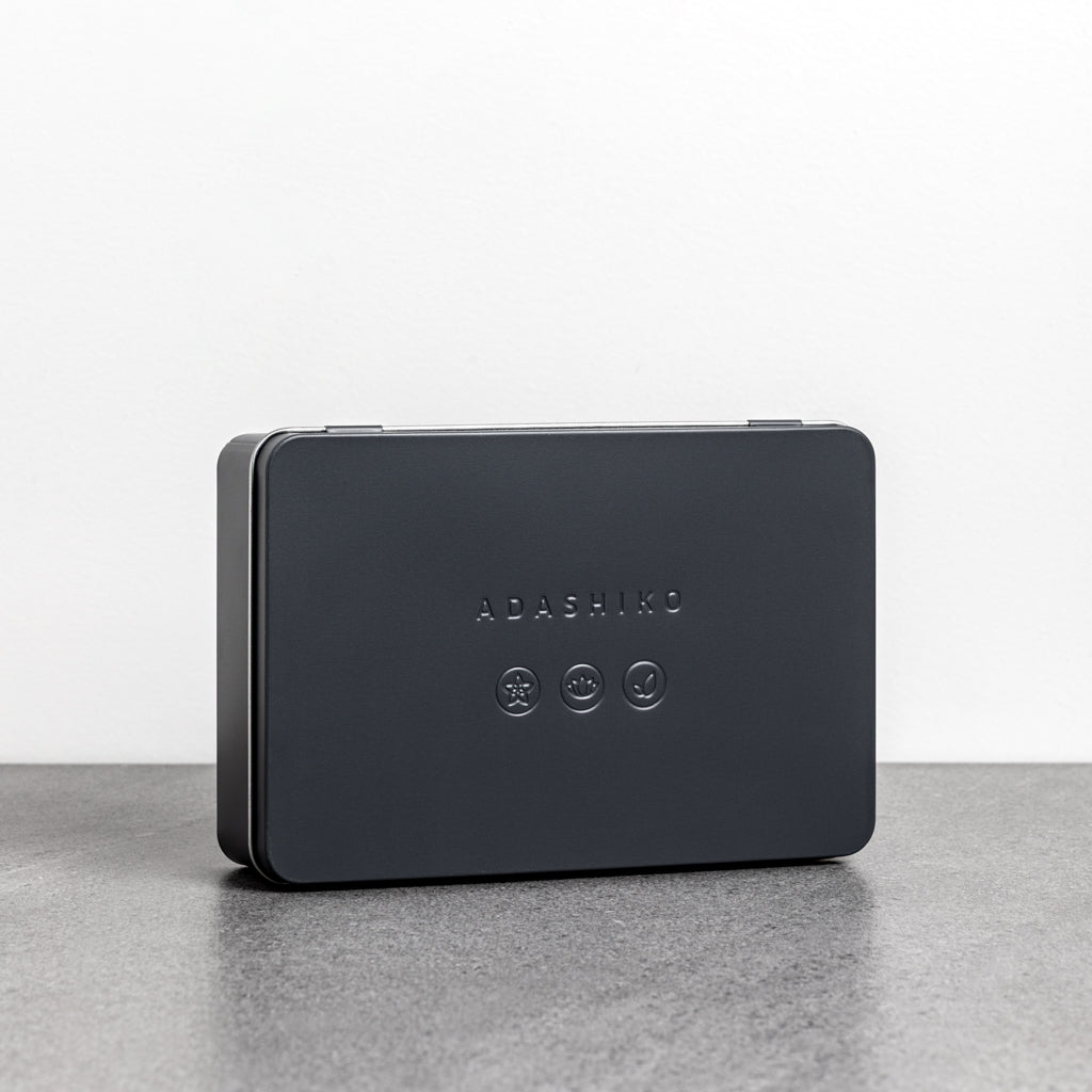 Adashiko Collagen Skincare Discovery Kit - closed tin sitting on bench top - Adashiko Collagen | 100% Natural Skincare