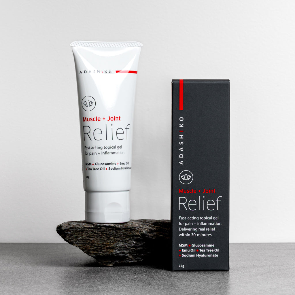 Tube + Box of Muscle + Joint Relief against a grey background | Adashiko Collagen | 100% Natural Skincare