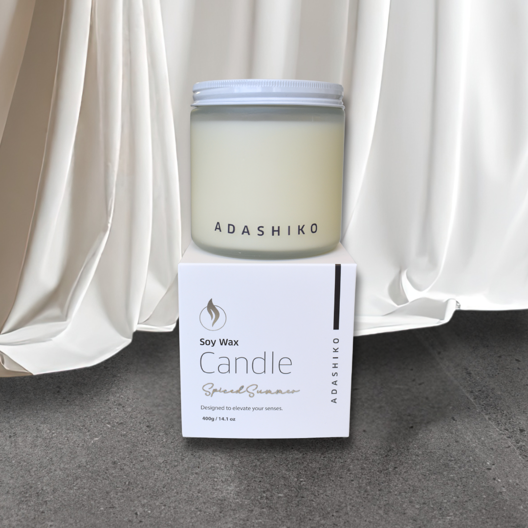 Adashiko Soy Wax Christmas Candle - Spiced Summer - jar sitting on top of packing box | Adashiko Collagen | 100% Natural Skincare