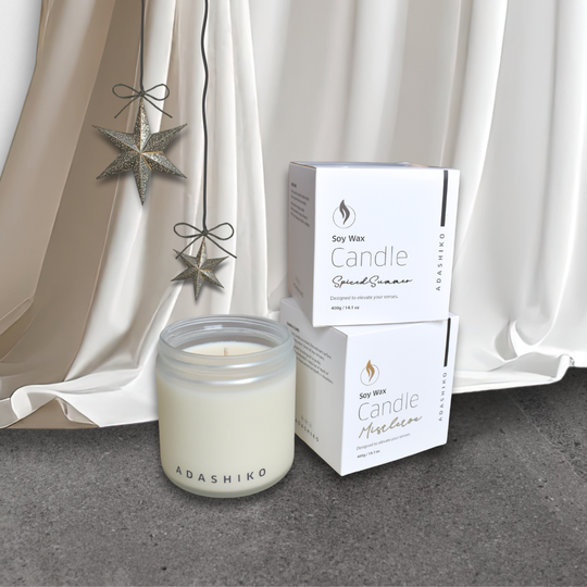 Adashiko Soy Wax Christmas Candles sitting next to Christmas Star decoration | Adashiko Collagen | 100% Natural Skincare