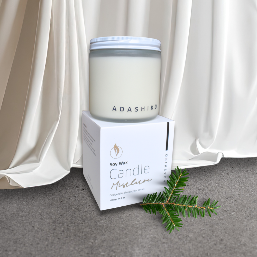 Adashiko Soy Wax Christmas Candle - Mistletoe - jar sitting on top of packing box | Adashiko Collagen | 100% Natural Skincare