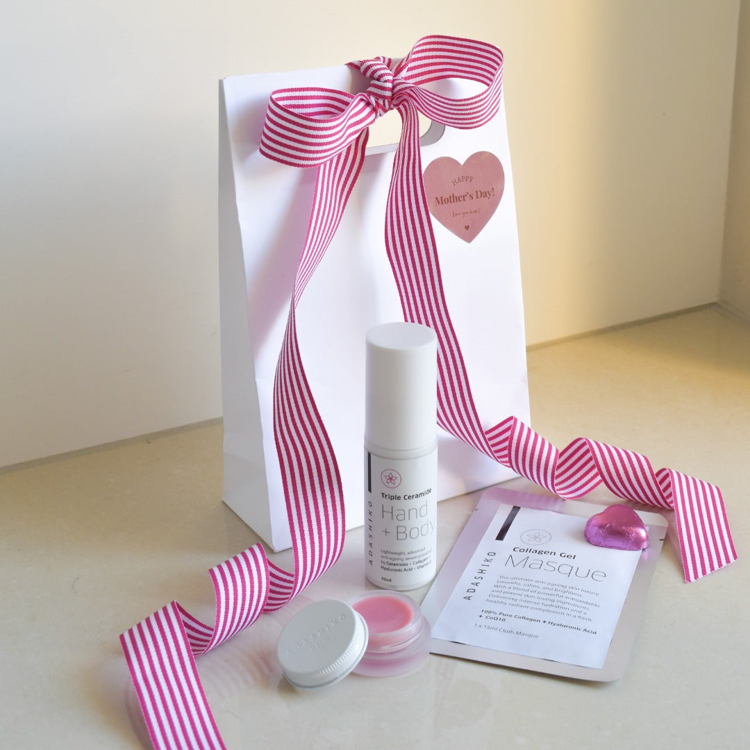 Mother's Touch Collection - Single Collagen Gel Masques + jar of Limited Edition "Blush" Collagen Balm + Triple Ceramide Hand + Body shown in front of gift bag | Adashiko Collagen | 100% Natural Skincare