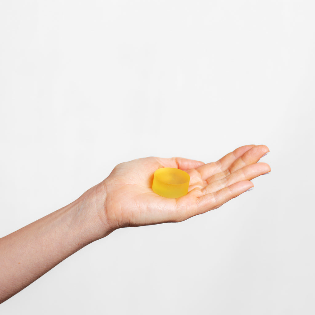 20g bar of Collagen Cleanse sitting in the palm of a hand | Adashiko Collagen | 100% Natural Skincare