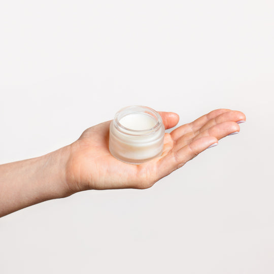 Collagen Balm - 30ml jar, open, held in a model's hand | Adashiko Collagen | 100% Natural Skincare