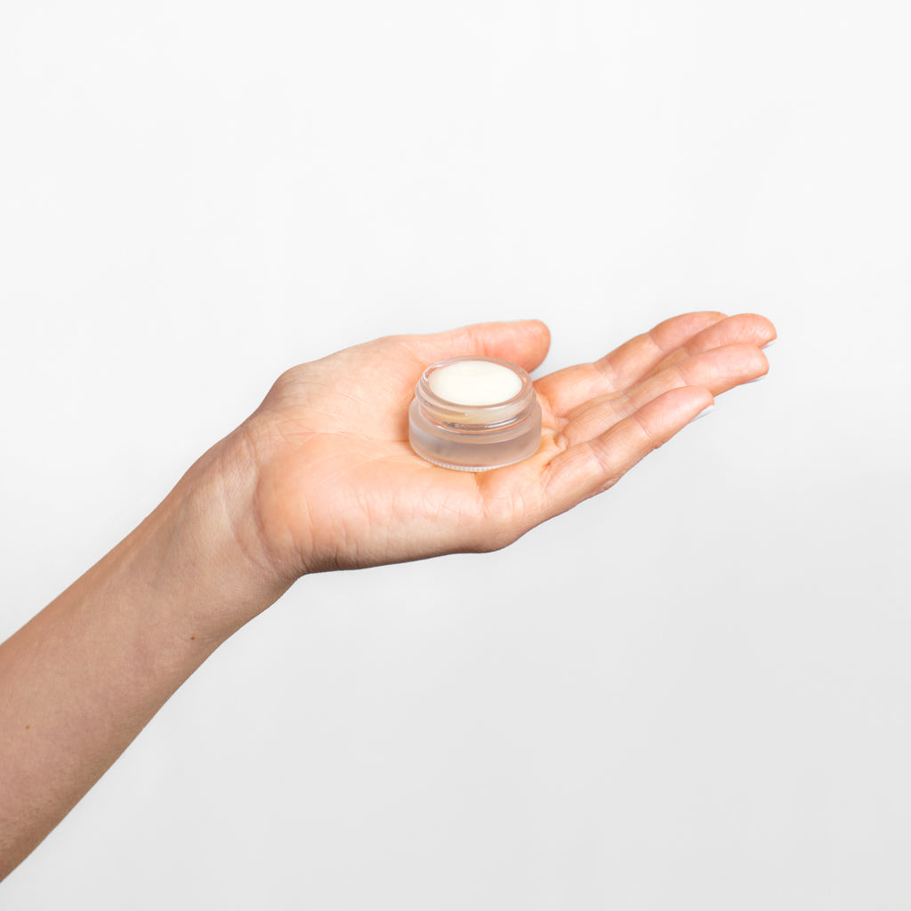 Collagen Balm - 5ml jar, open, held in a model's hand | Adashiko Collagen | 100% Natural Skincare