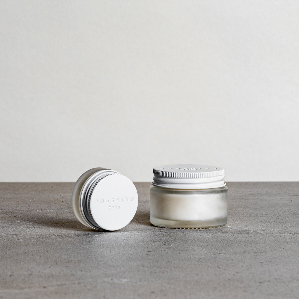 Collagen Balm - 5ml & 30ml jars side by side against a grey background | Adashiko Collagen | 100% Natural Skincare