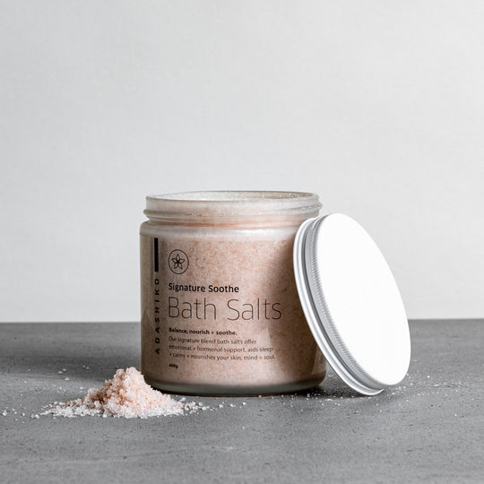 Signature Soothe Bath Salts - jar with lid off & some bath salts on worktop | Adashiko Collagen | 100% Natural Skincare