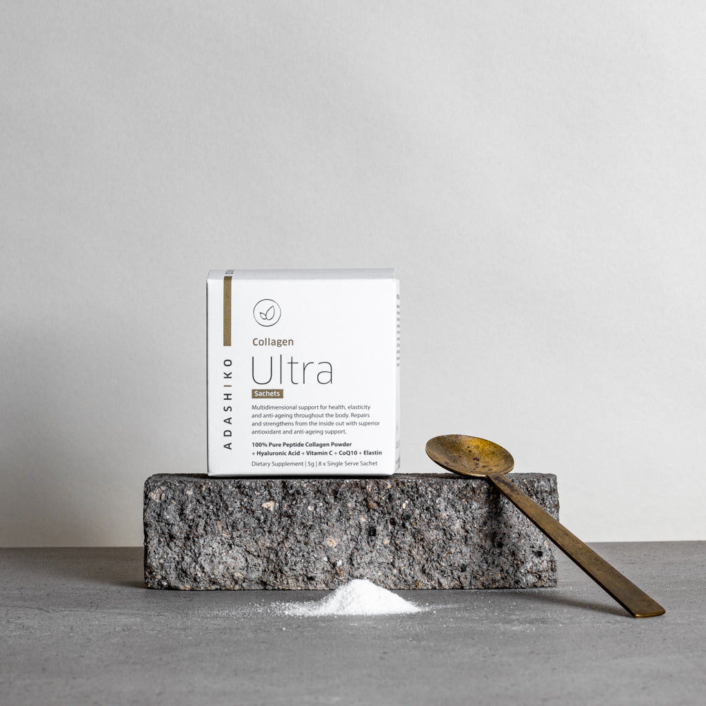 Ultra Collagen Powder Travel Sachets - box sitting on stone with spoon & measure of collagen powder | Adashiko Collagen | !00% Natural Skincare