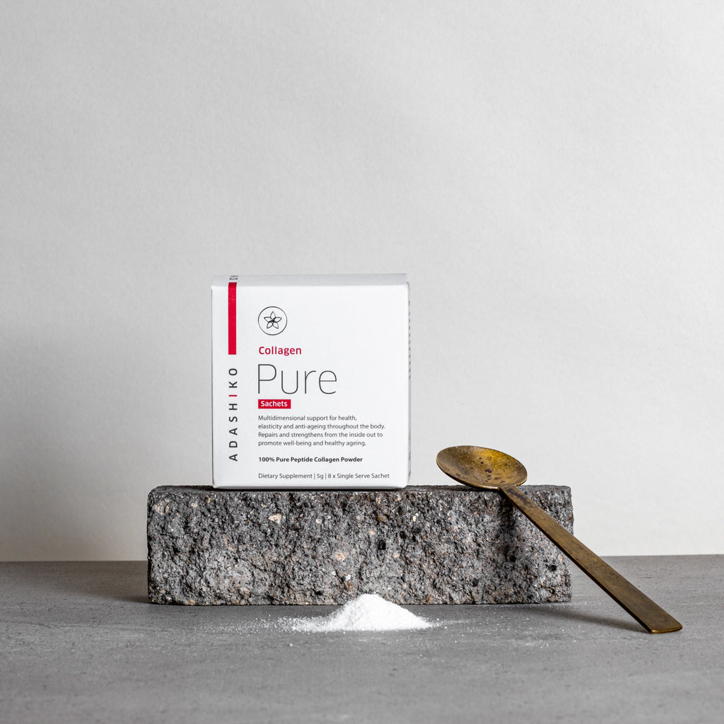 Pure Collagen Powder Travel Sachets - box sitting on stone with spoon & measure of collagen powder | Adashiko Collagen | !00% Natural Skincare