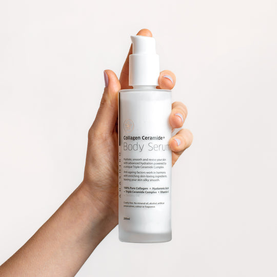 Collagen Ceramide + Body Serum 200ml - bottle held in a model's hand | Adashiko Collagen | 100% Natural Skincare