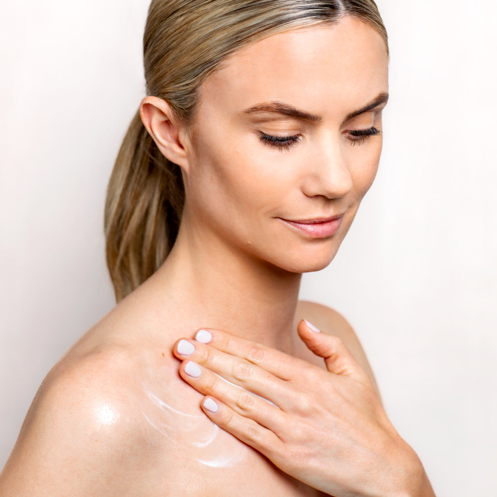 Model applying Collagen Ceramide + Body Serum to her body | Adashiko Collagen | 100% Natural Skincare