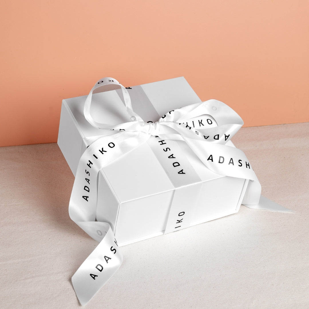 Unwind Gift Box shown closed with ribbon wrapping | Adashiko Collagen | 100% Natural Skincare